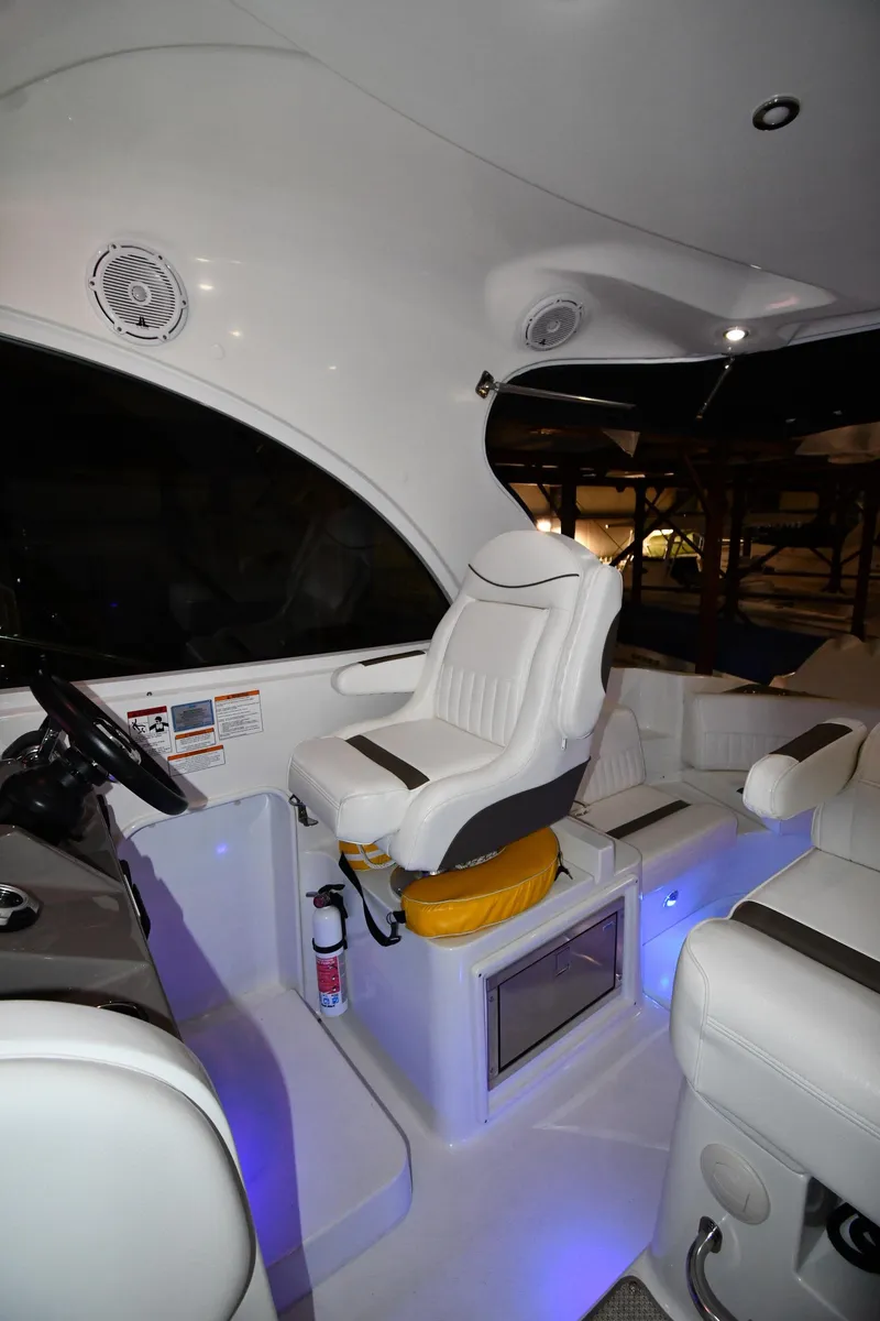 Slide: The Image of 2012 Cruisers Yachts 390 Sports Coupe interior with white seating and modern controls. - 14