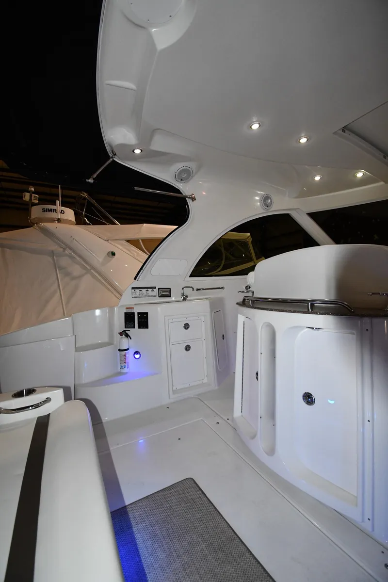Slide: The Image of 2012 Cruisers Yachts 390 Sports Coupe interior with modern lighting and sleek design. - 18