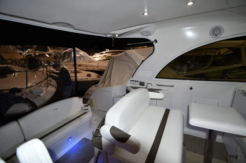 Slide: The Image of Interior of 2012 Cruisers Yachts 390 Sports Coupe with modern seating and ambient lighting. - 19