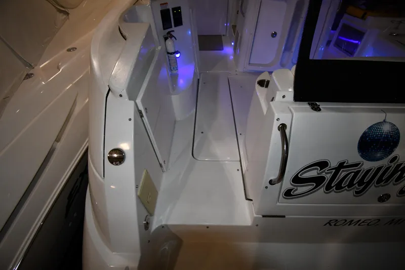 Slide: The Image of 2012 Cruisers Yachts 390 Sports Coupe interior with ambient blue lighting. - 21