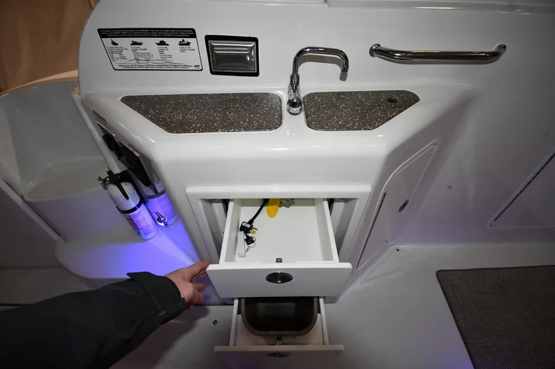 Slide: The Image of 2012 Cruisers Yachts 390 Sports Coupe interior with sink, drawers, and faucet. - 23