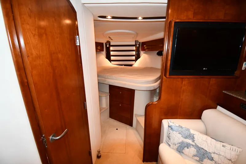 Slide: The Image of Luxurious interior of 2012 Cruisers Yachts 390 Sports Coupe with cozy bed and elegant wood finish. - 27