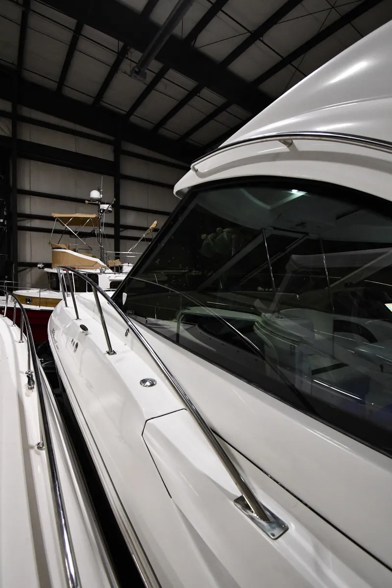 Slide: The Image of 2012 Cruisers Yachts 390 Sports Coupe in storage, showcasing sleek design and modern features. - 3