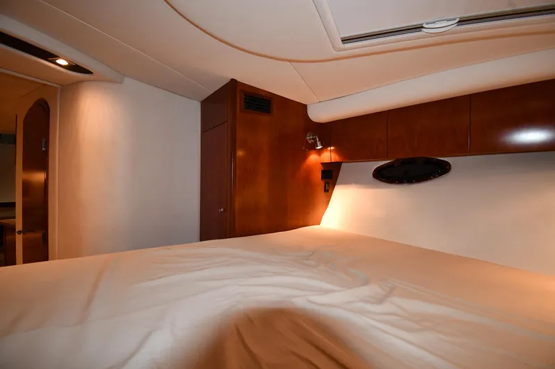 Slide: The Image of Luxurious cabin interior of 2012 Cruisers Yachts 390 Sports Coupe with wood accents. - 31