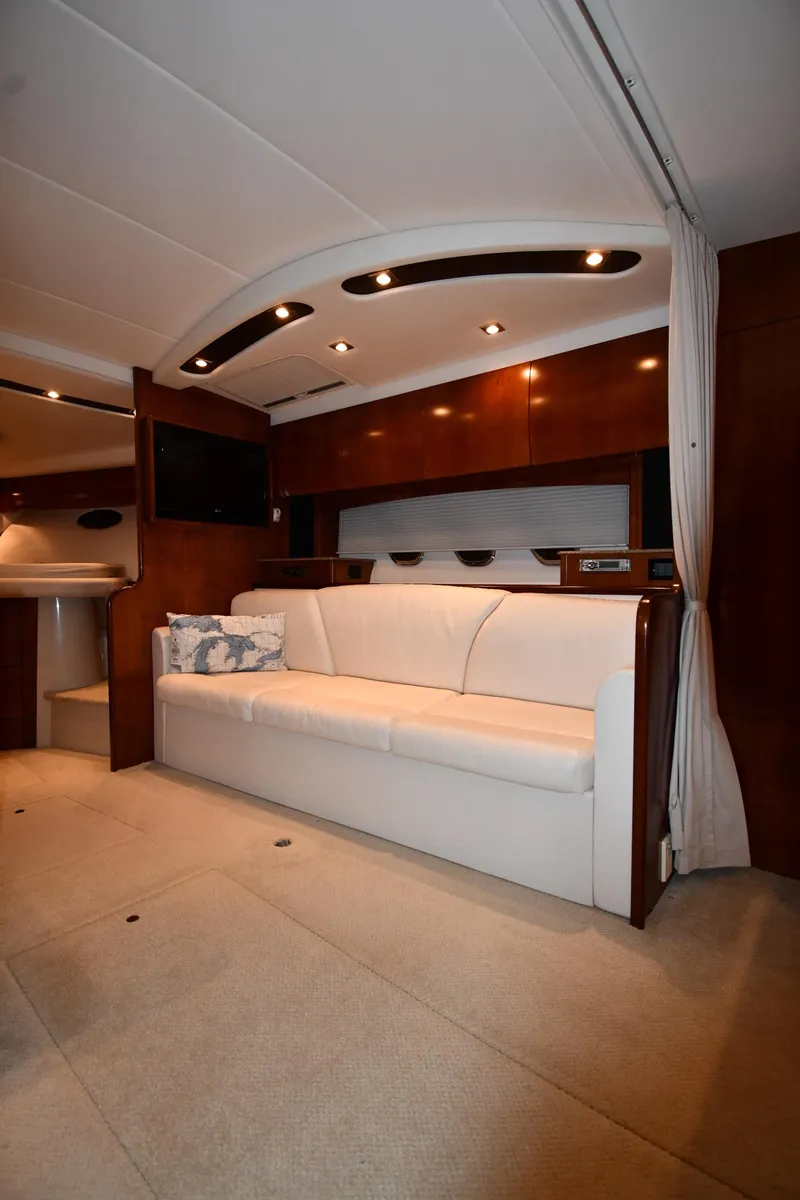Slide: The Image of Interior of 2012 Cruisers Yachts 390 Sports Coupe with elegant seating and modern lighting. - 34