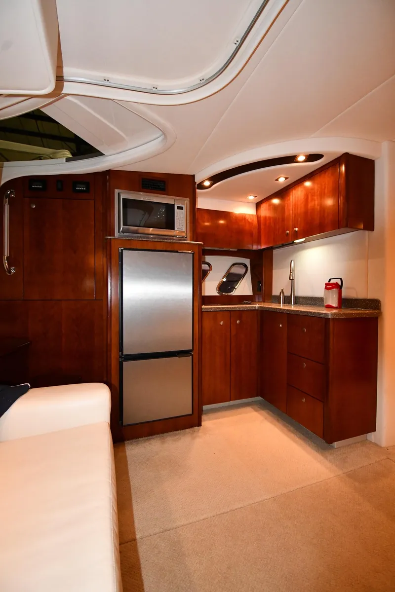 Slide: The Image of Interior of 2012 Cruisers Yachts 390 Sports Coupe with modern kitchen amenities. - 36