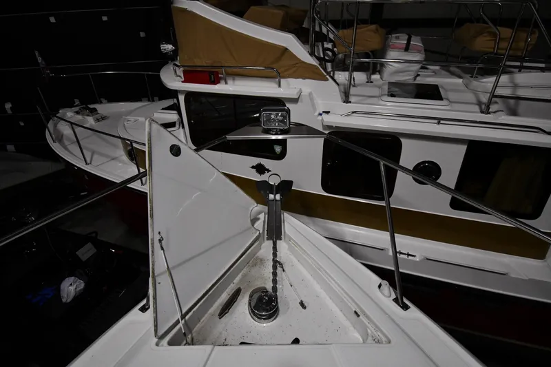 Slide: The Image of 2012 Cruisers Yachts 390 Sports Coupe, boat deck view with anchor chain. - 4