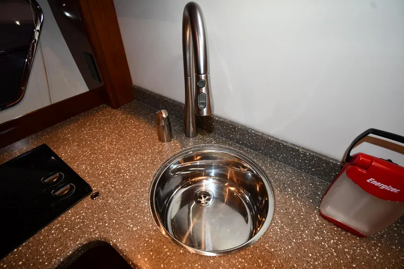 Slide: The Image of Stainless steel sink in 2012 Cruisers Yachts 390 Sports Coupe kitchen area. - 41
