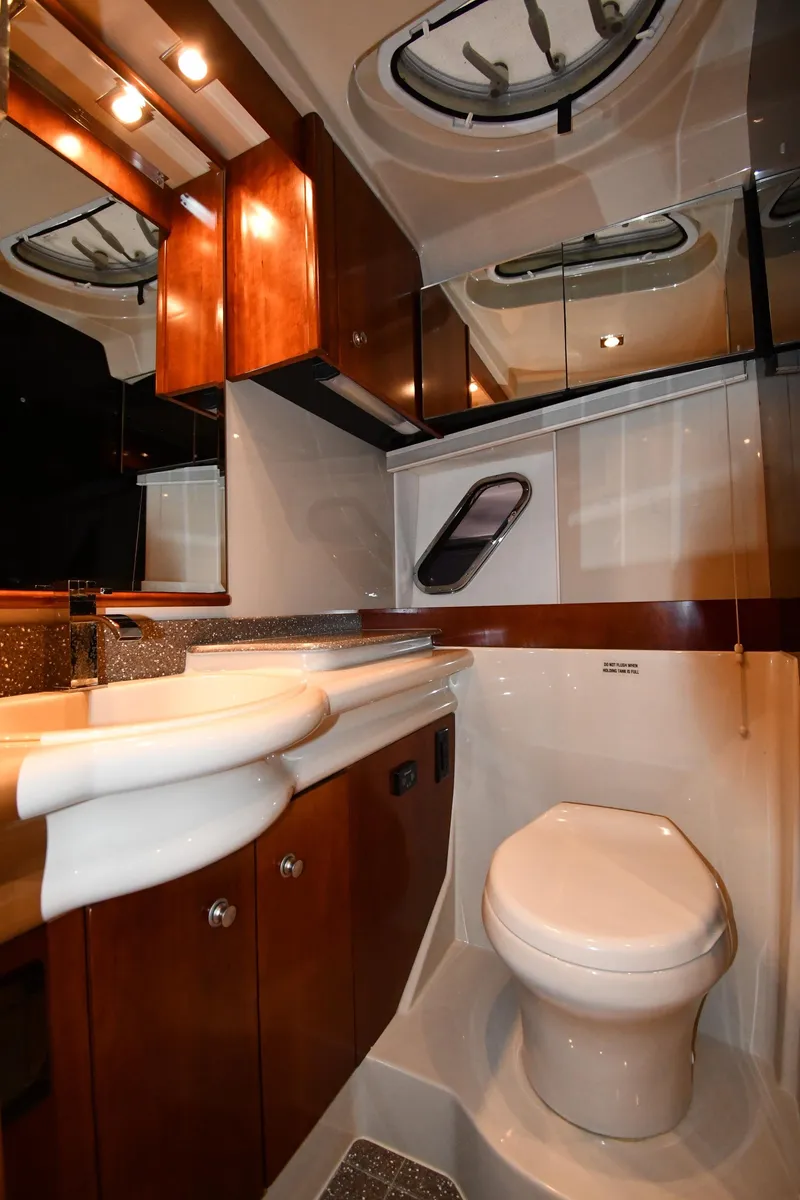 Slide: The Image of Luxurious bathroom in 2012 Cruisers Yachts 390 Sports Coupe with modern fixtures and wood cabinetry. - 49