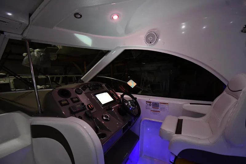 Slide: The Image of Interior cockpit of 2012 Cruisers Yachts 390 Sports Coupe with illuminated controls and seating. - 9