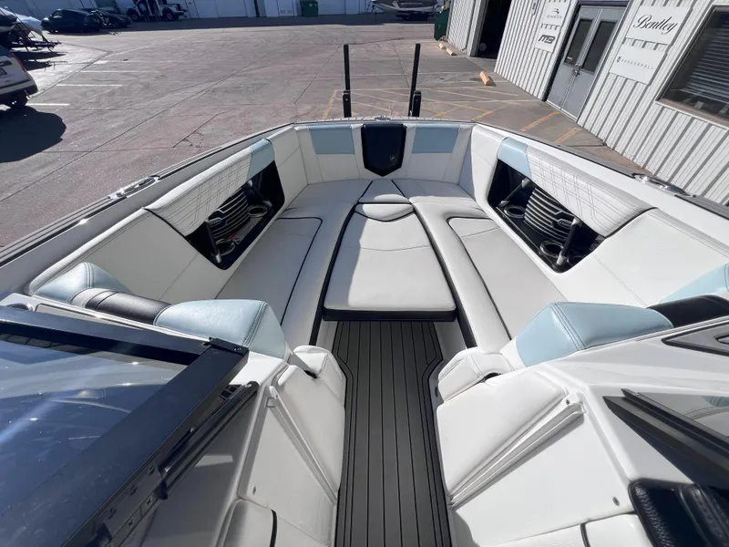 Slide: The Image of 2019 Nautique Super Air Nautique G25 boat interior with sleek seating and modern design. - 14