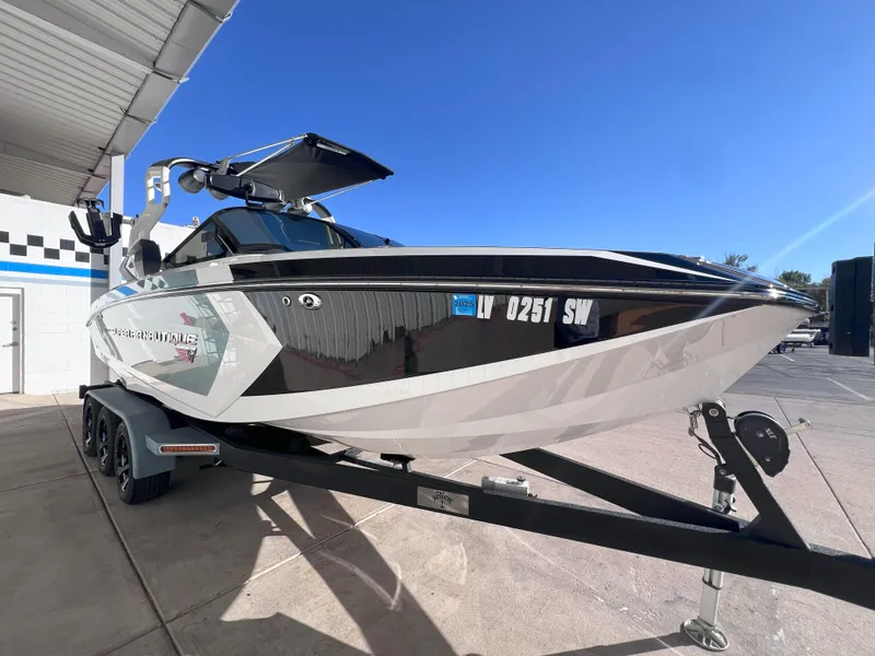 Slide: The Image of 2019 Nautique Super Air Nautique G25 boat on trailer, parked outdoors. - 4