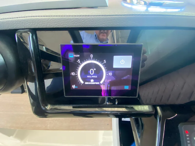 Slide: The Image of Dashboard display of 2023 Sea Ray SLX 400 OB boat showing digital gauge. - 31