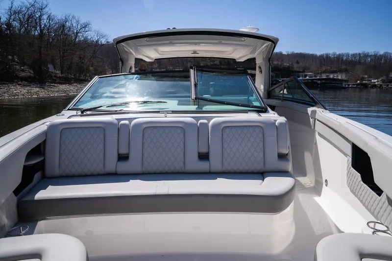Slide: The Image of 2023 Sea Ray SLX 400 OB boat interior with luxurious seating and open deck design. - 33