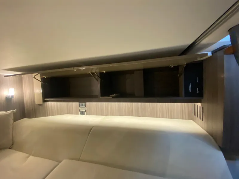 Slide: The Image of Interior cabin of 2023 Sea Ray SLX 400 OB with modern storage compartments. - 51