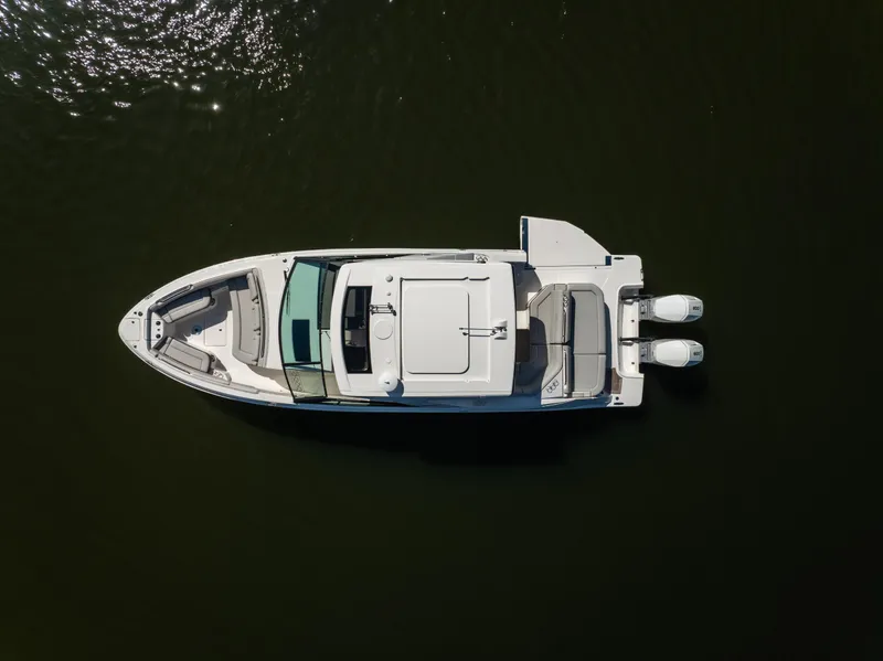 Slide: The Image of 2023 Sea Ray SLX 400 OB boat, aerial view on dark water. - 53