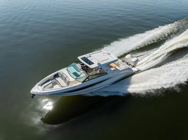 Slide: The Image of 2023 Sea Ray SLX 400 OB cruising on open water, showcasing sleek design and powerful performance. - 8