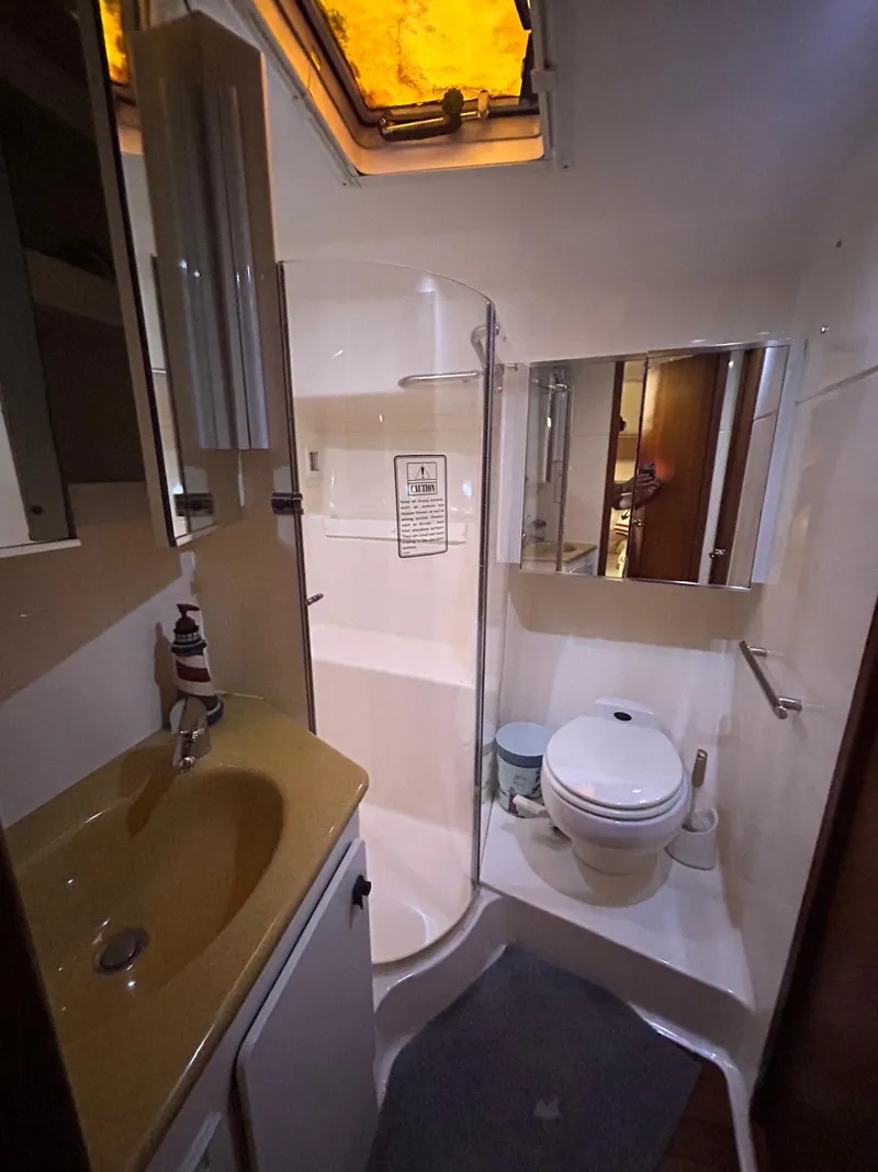 Slide: The Image of Bathroom interior of 2003 Tiara Yachts 4000 Express with shower and toilet. - 14