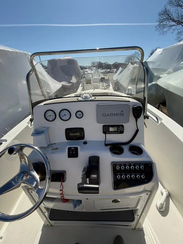 Slide: The Image of 2018 NauticStar 2102 Legacy boat dashboard with Garmin navigation system. - 3