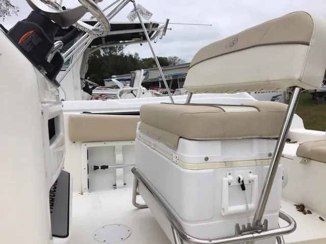 Slide: The Image of 2018 NauticStar 2102 Legacy boat interior with seating and steering wheel. - 4
