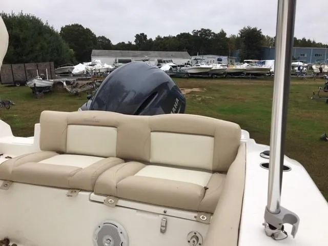 Slide: The Image of 2018 NauticStar 2102 Legacy boat with Yamaha outboard motor in a boatyard. - 5