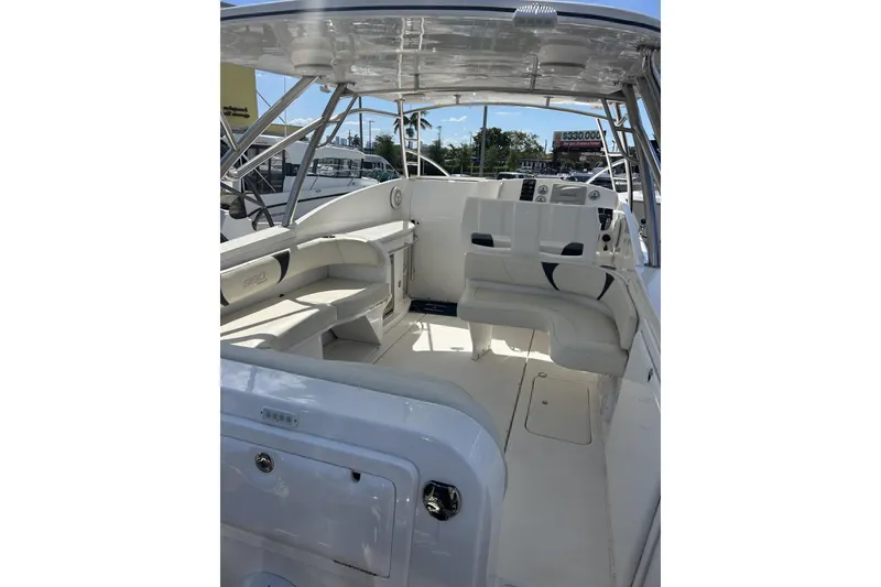 Slide: The Image of 2018 Intermarine 380 Sport boat interior with white seating and modern dashboard. - 14