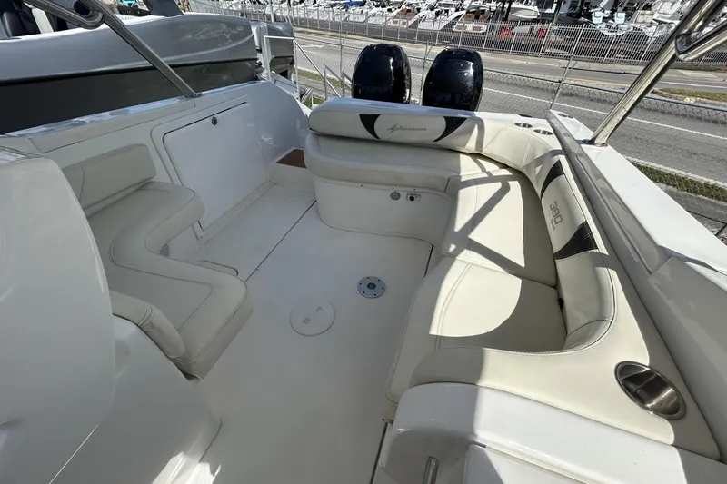 Slide: The Image of 2018 Intermarine 380 Sport boat interior with white seating and dual engines. - 17