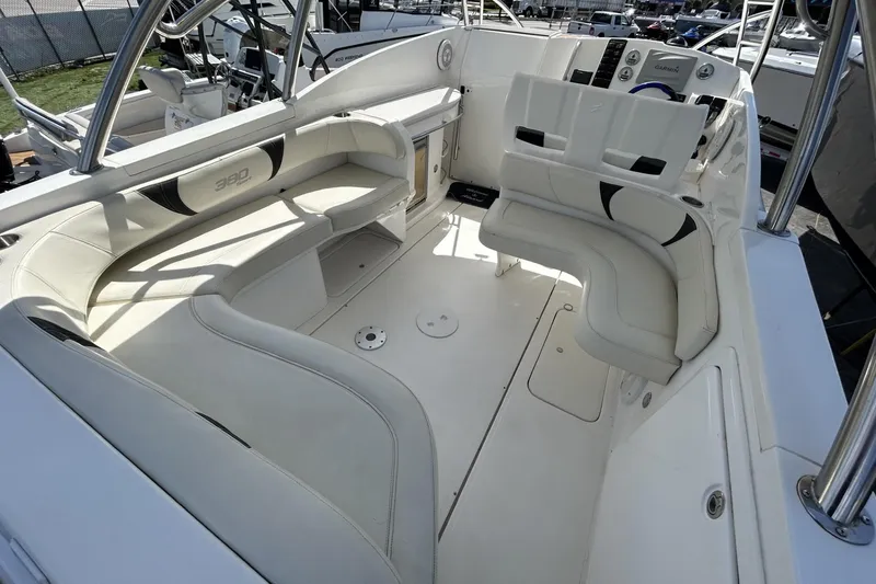 Slide: The Image of 2018 Intermarine 380 Sport boat interior with white seating and modern dashboard. - 18