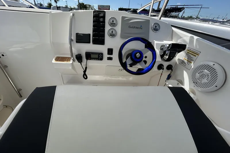 Slide: The Image of 2018 Intermarine 380 Sport boat cockpit with Garmin navigation and modern controls. - 19