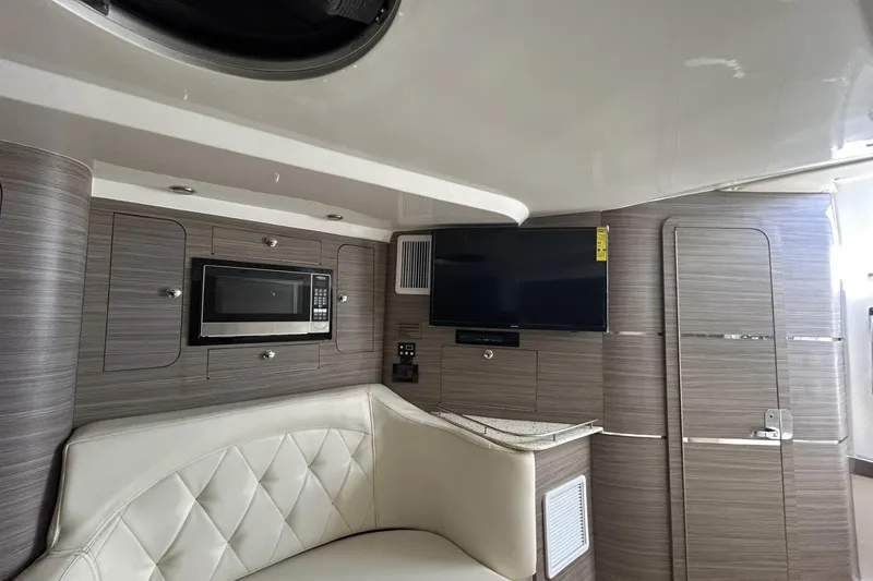 Slide: The Image of Interior of 2018 Intermarine 380 Sport yacht with TV, microwave, and seating. - 25