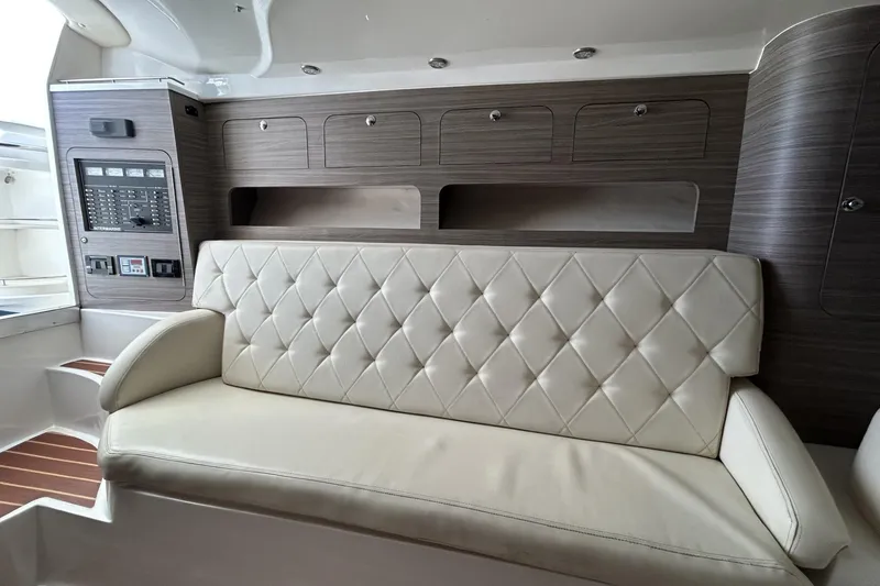Slide: The Image of Luxurious interior of 2018 Intermarine 380 Sport yacht with leather seating and wood paneling. - 26