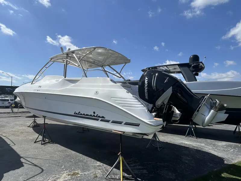 Slide: The Image of 2018 Intermarine 380 Sport boat on stands, with clear blue sky background. - 3