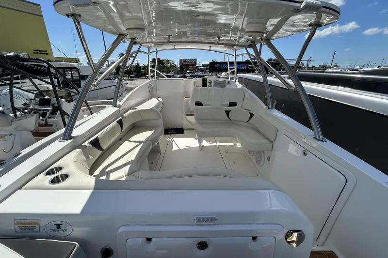 Slide: The Image of 2018 Intermarine 380 Sport boat interior with white seating and canopy. - 34