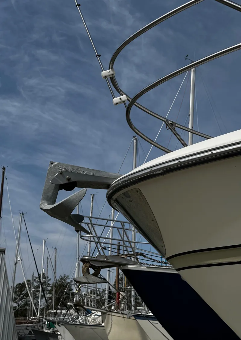 Slide: The Image of 1998 Maxum 4100 SCA yacht docked with clear blue sky background. - 13