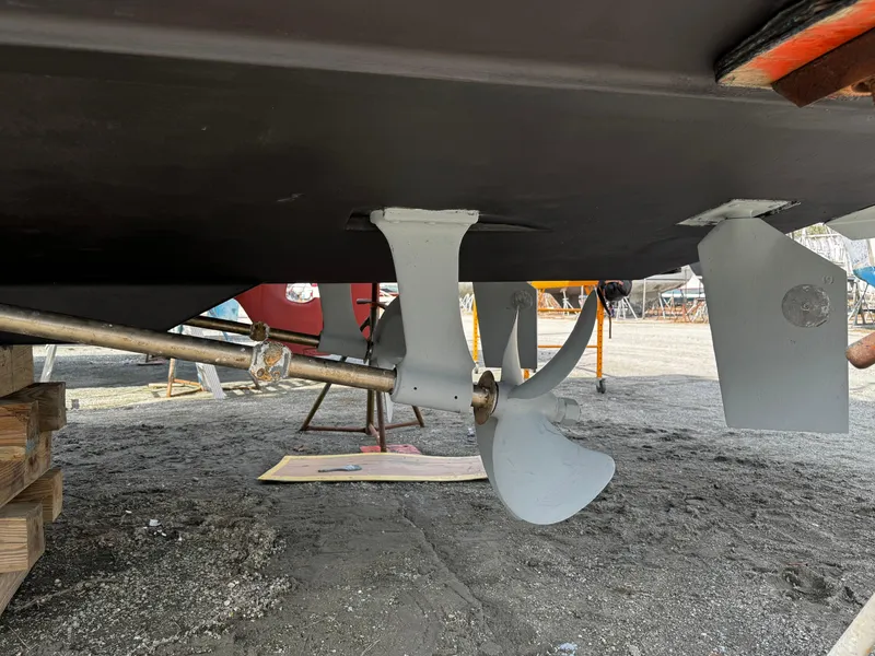 Slide: The Image of Propeller and rudder of a 1998 Maxum 4100 SCA boat on dry dock. - 16