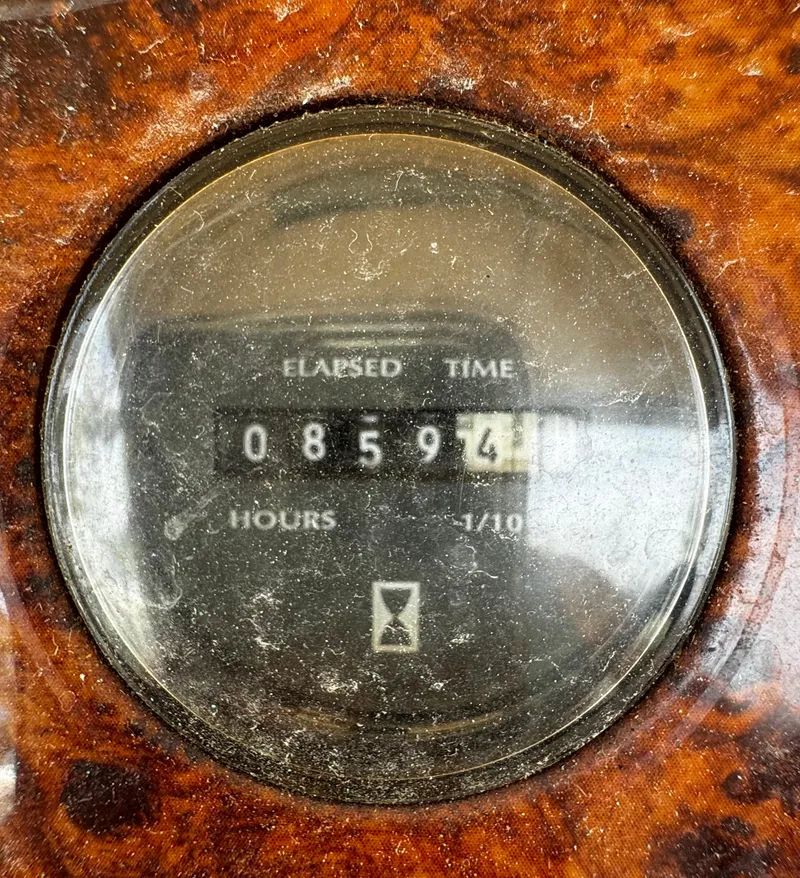 Slide: The Image of Hour meter showing 8594.1 hours on a 1998 Maxum 4100 SCA boat. - 33