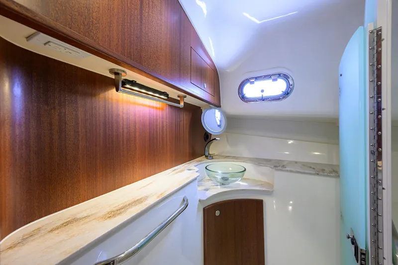 Slide: The Image of Luxurious bathroom interior of 2023 Pursuit 385 Offshore yacht with wood accents and modern fixtures. - 15