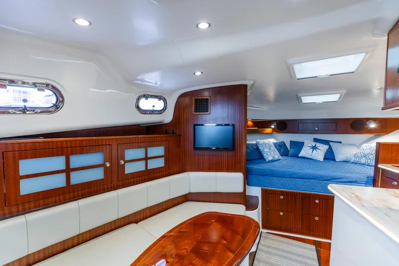 Slide: The Image of Luxurious interior of 2018 Pursuit OS 385 Offshore yacht with cozy seating and elegant wood finishes. - 15