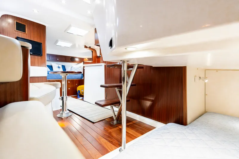 Slide: The Image of Luxurious interior of 2018 Pursuit OS 385 Offshore yacht with wood finish and modern amenities. - 25