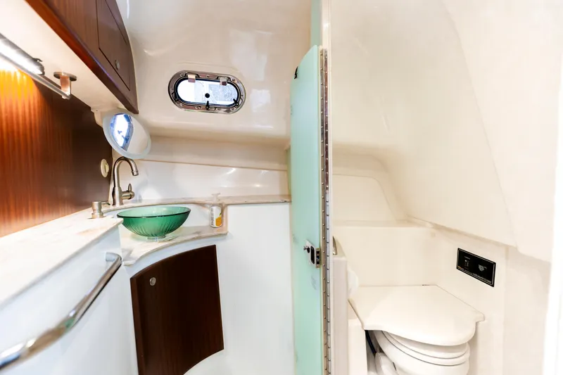 Slide: The Image of 2018 Pursuit OS 385 Offshore yacht bathroom with modern sink and toilet. - 27