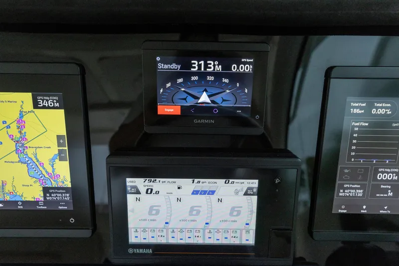 Slide: The Image of Control panel of a 2018 Pursuit OS 385 Offshore boat with Garmin and Yamaha displays. - 41