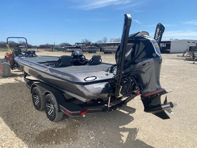 Slide: The Image of 2025 Skeeter ZXR21 boat with Yamaha engine on a trailer, parked outdoors. - 3