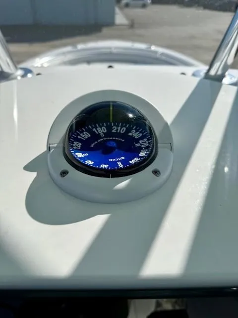 Slide: The Image of Compass on 2024 Contender 24 Sport boat dashboard, showing navigation details. - 14