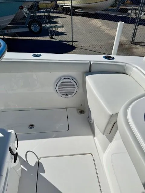 Slide: The Image of 2024 Contender 24 Sport boat interior with seating and speaker. - 15