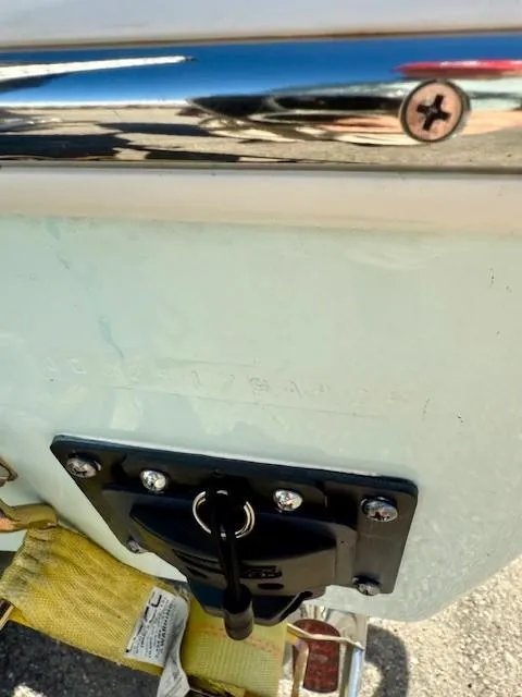 Slide: The Image of 2024 Contender 24 Sport boat detail with chrome and mounted hardware. - 17