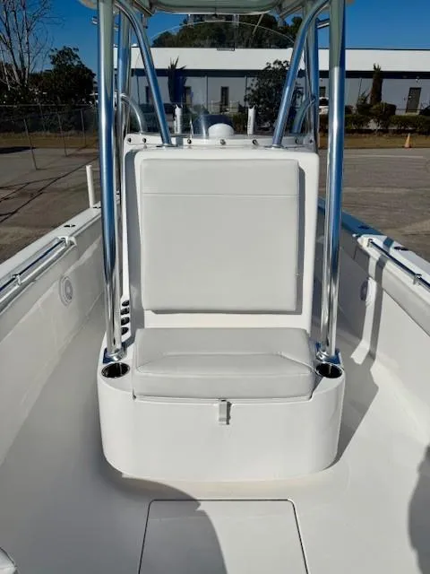 Slide: The Image of 2024 Contender 24 Sport boat interior with seating and stainless steel frame. - 8