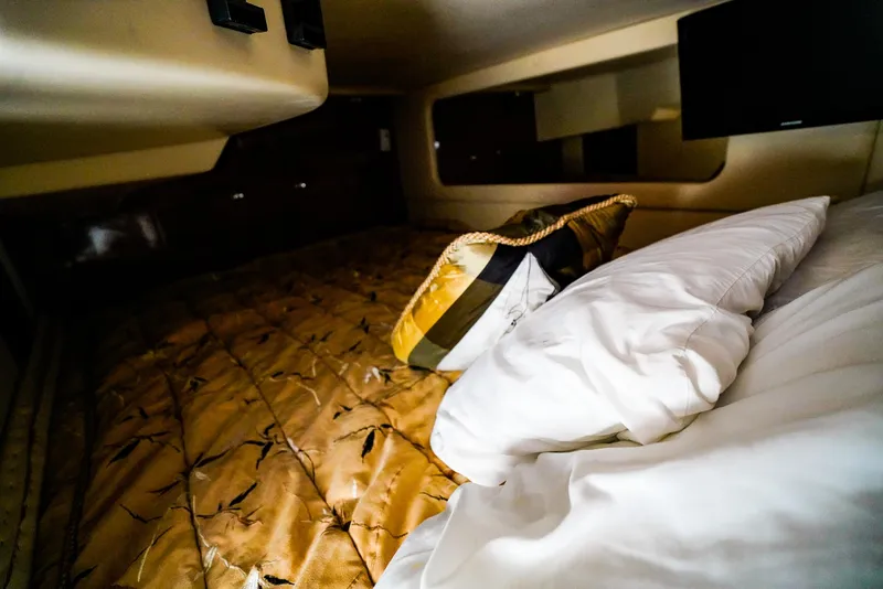 Slide: The Image of Interior cabin of 2007 Regal 3060 Window Express with cozy bedding. - 15