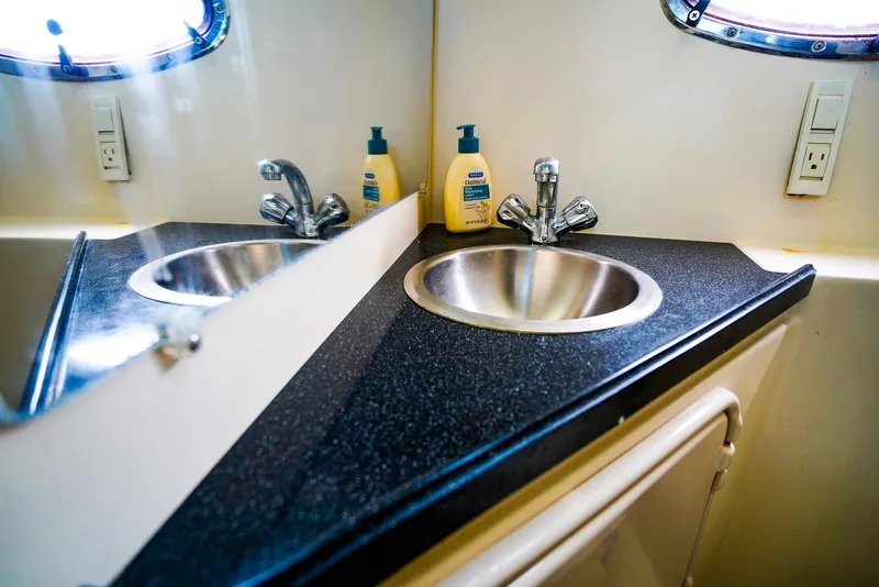 Slide: The Image of 2007 Regal 3060 Window Express bathroom sink with mirror and toiletries. - 17