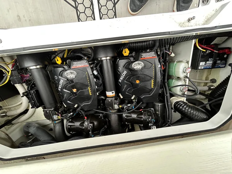 Slide: The Image of Engine compartment of 2020 Scarab 255 Open ID boat, showcasing dual Rotax engines. - 14