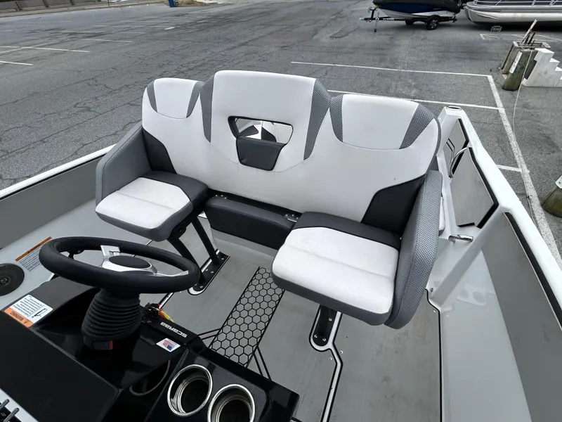 Slide: The Image of 2020 Scarab 255 Open ID boat interior with dual seats and steering console. - 4